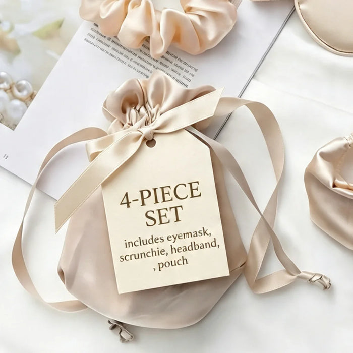 A beige satin 4-piece set gift pouch tied with a ribbon and tag, shown with matching satin scrunchies and headbands on a light background.