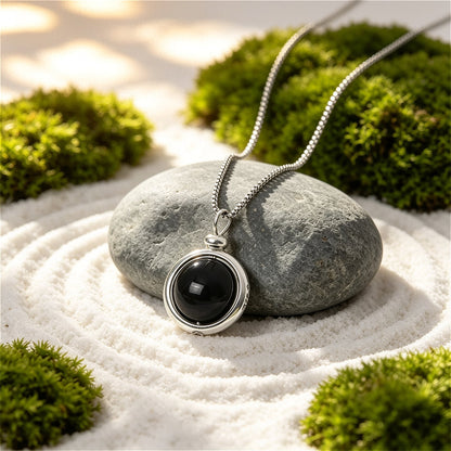 Polished natural Black Agate sphere necklace, a timeless piece for grounding and masculine protection.